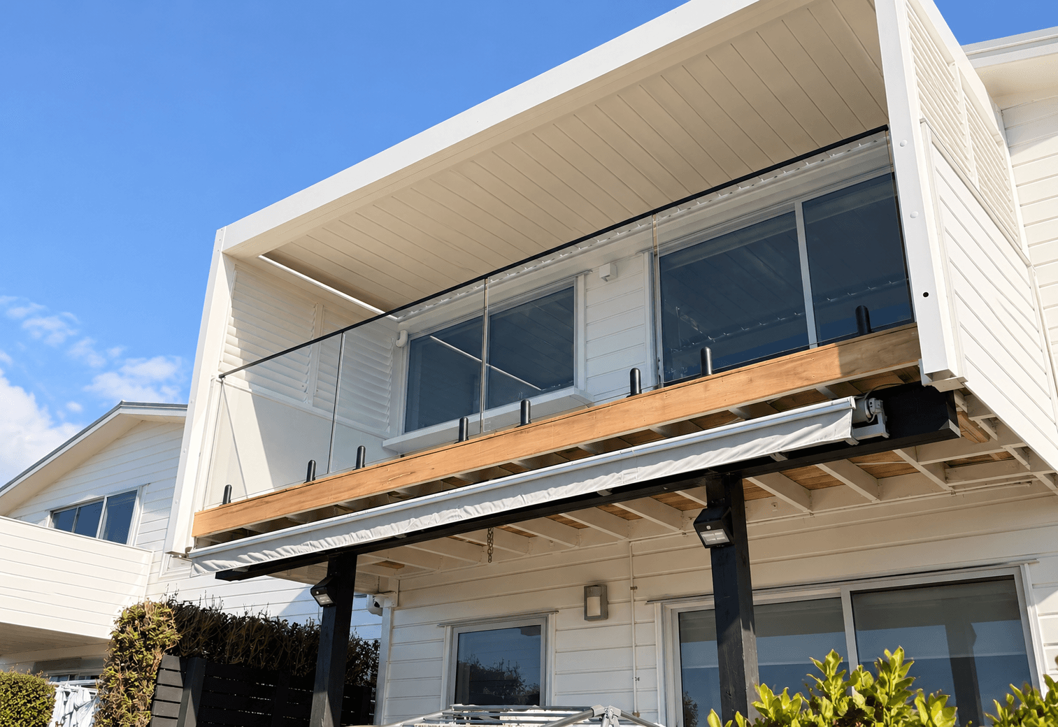 Balcony glass with black spigots and a black frame
