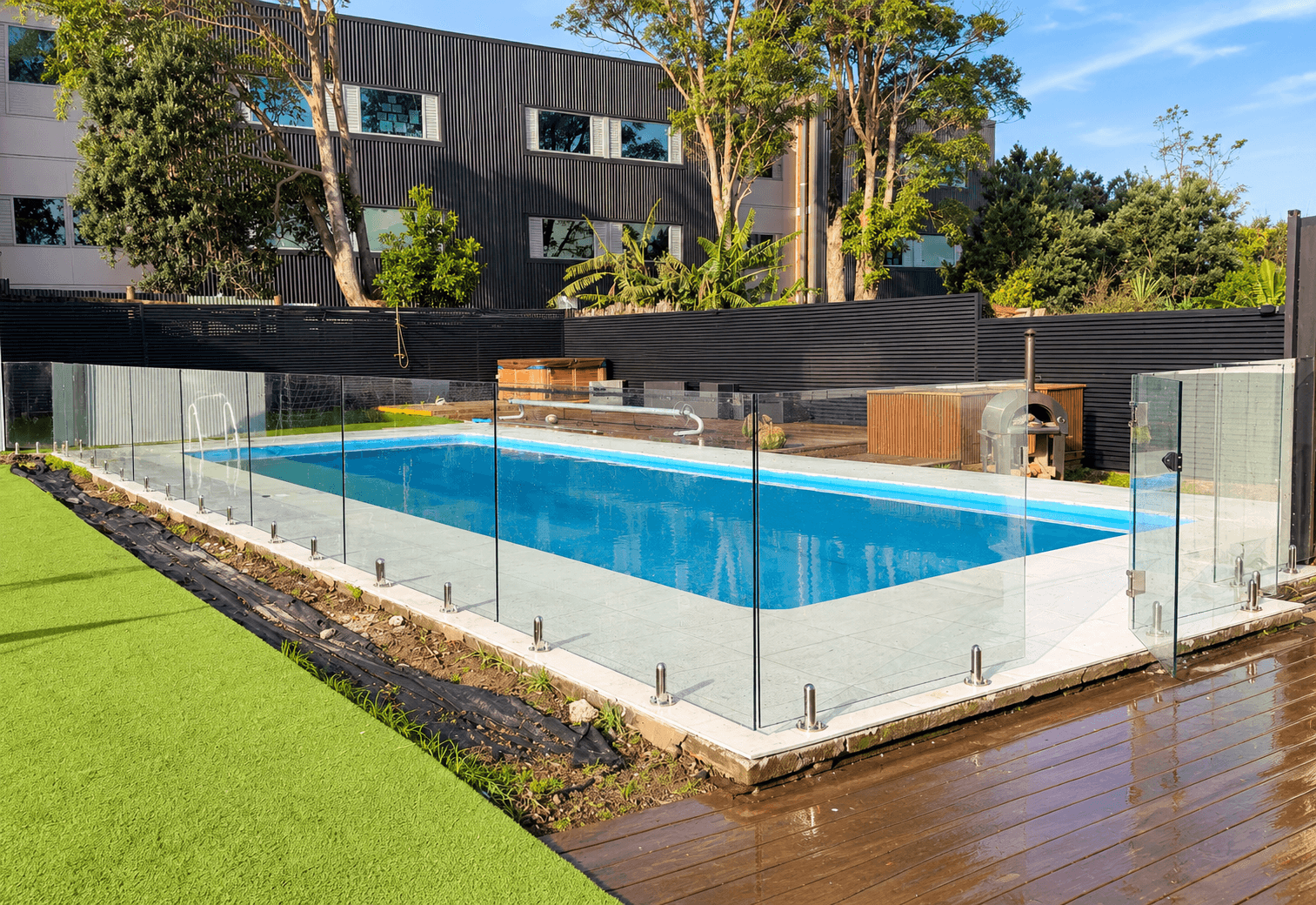 Glass pool fence and gate with silver spigots